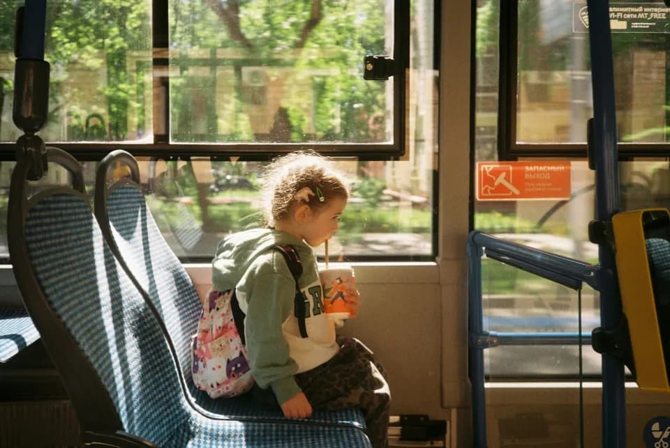 Little girl riding the bus alone