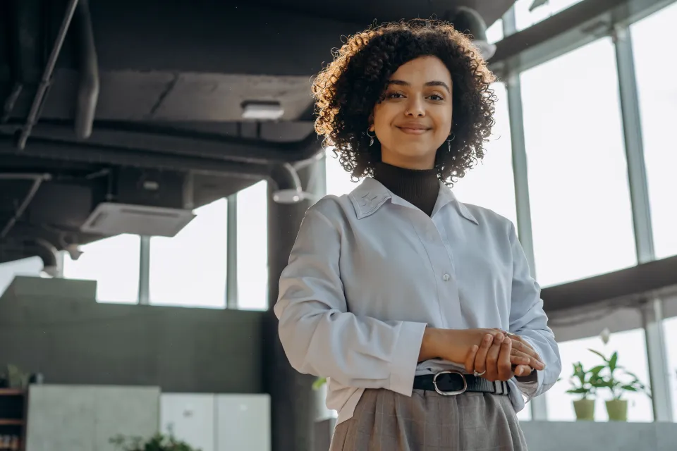 Confident woman standing in the light